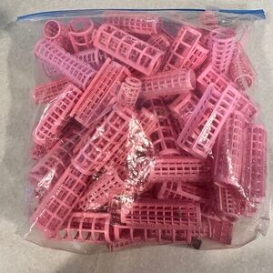 Vintage pink plastic hair rollers